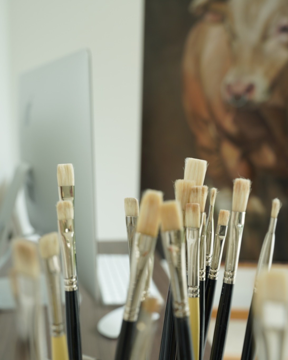 Animal Presence studio process — brushes and bull painting